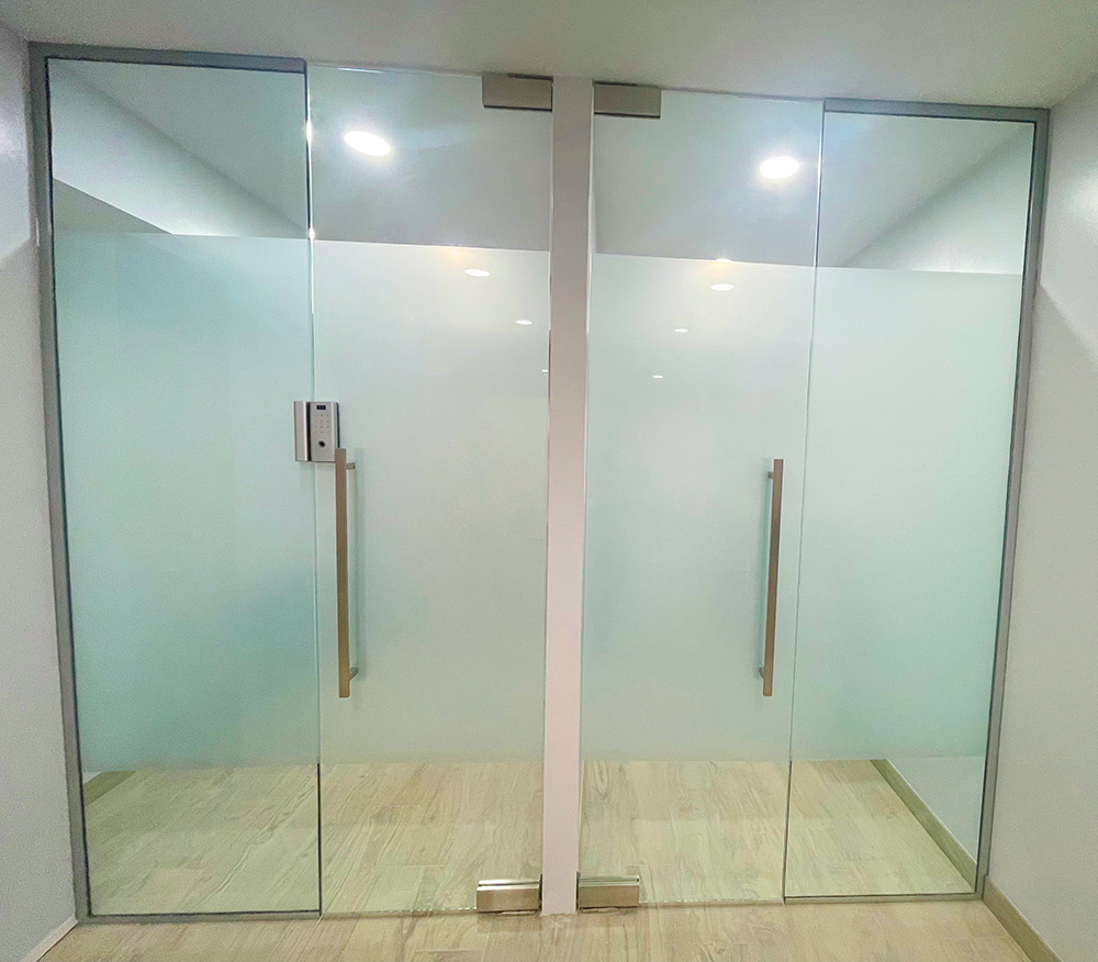 Double glass doors with translucent privacy panels and clear upper sections
